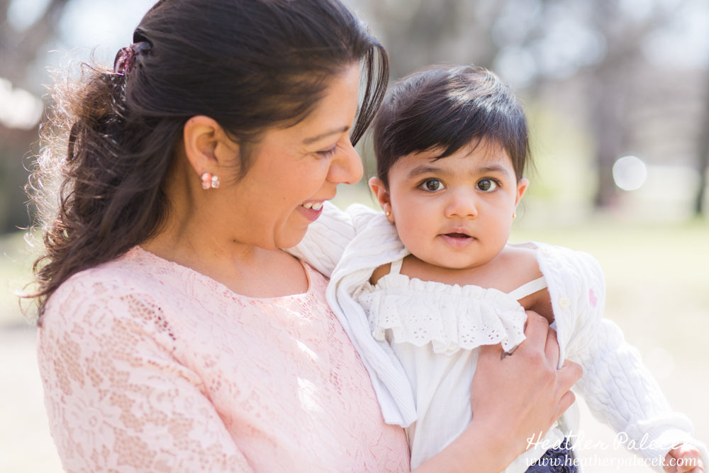 family portrait in cherry blossom trees