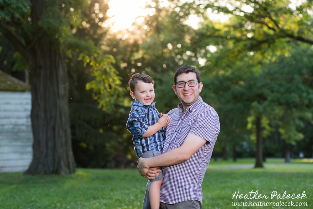son and dad posing