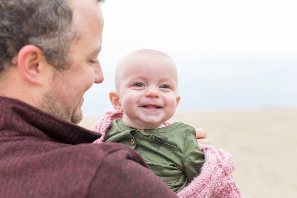 daughter and father on beach