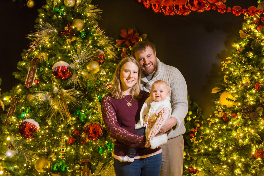 family christmas portrait in front of tree