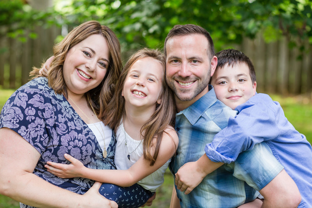 family of four posing
