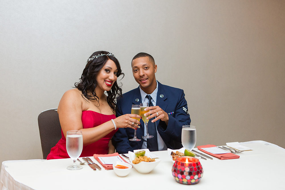 Bride and Groom cheers champagne glasses