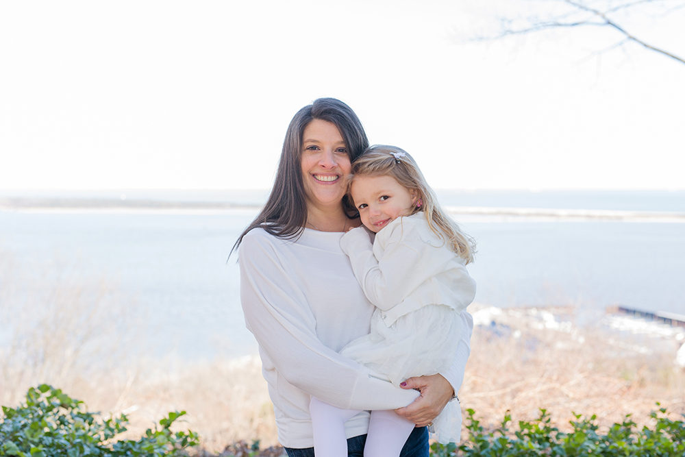 family portrait in front of water