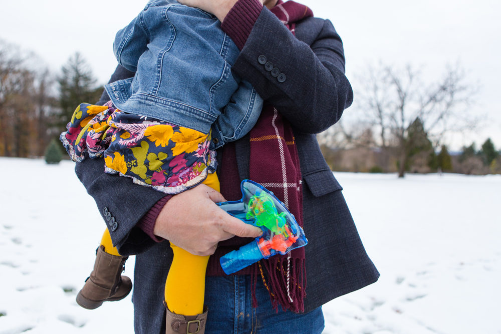 Family playing with bubble guns