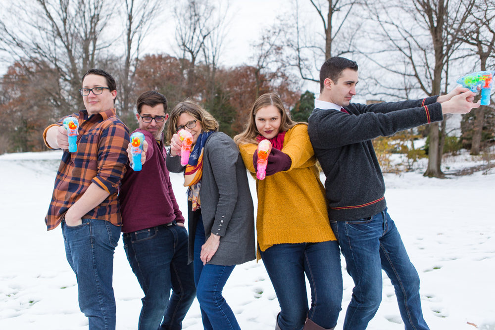 Family playing with bubble guns