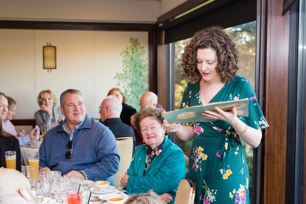 woman gives speech at birthday party