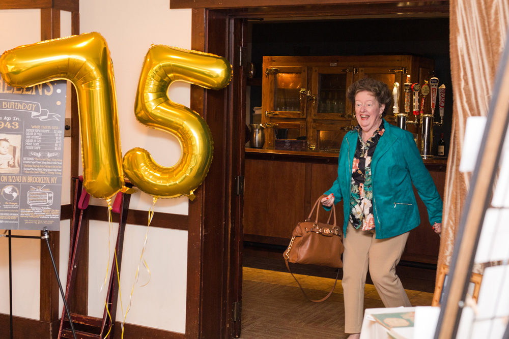 woman walks into surprise party