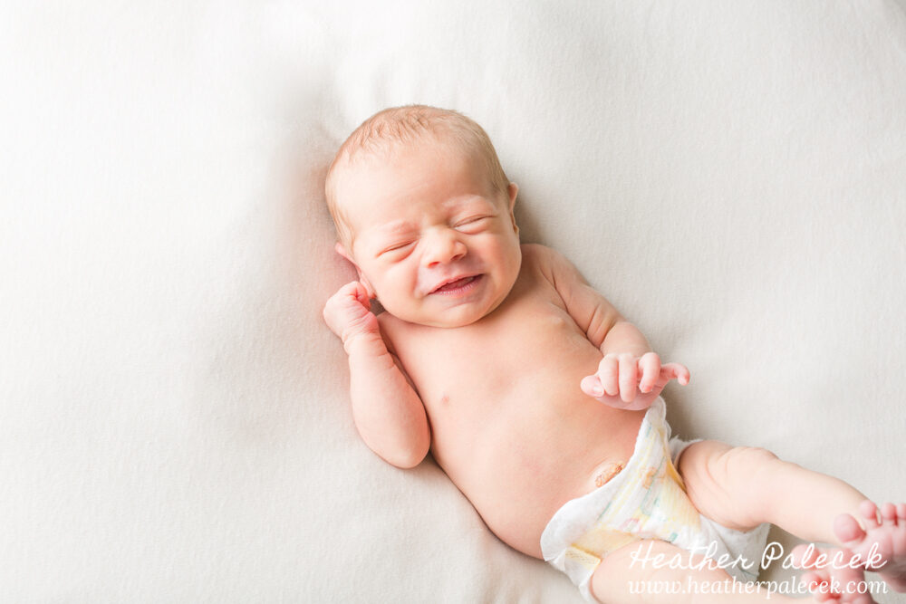 newborn girl stretching