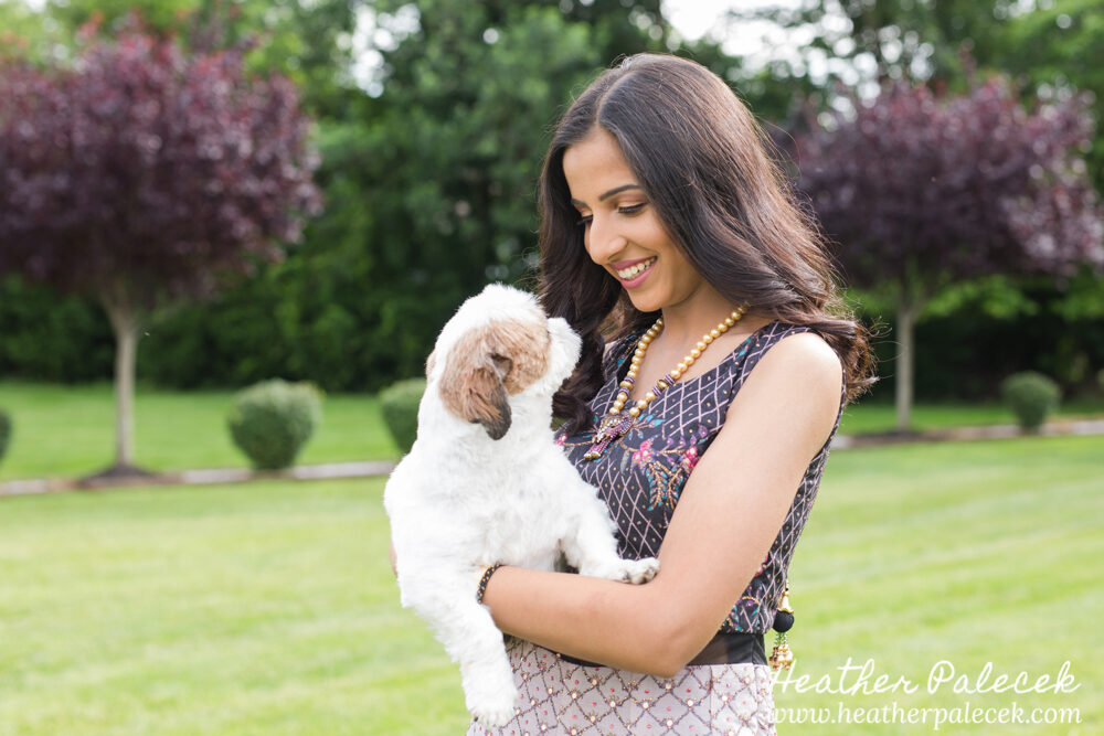 teenage girl poses with her dog for sweet sixteen portrait session